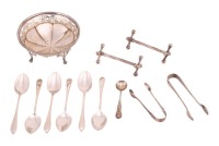A small collection of silver items, including a pair of cast silver "Jacks" knife dogs, Sheffield 1907(?) by Walker and Hall, together with other small silver of similar vintage. 12.65 ozt/ 393.7 grams collective gross weight of silver.