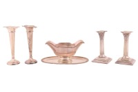 A pair of Victorian silver Corinthian column table candlesticks, with loaded bases, London 1873 by Hodd & Hodd, 16 cm overall height, together with a pair of Deakins silver tube epergnes (loaded bases), a heavy white metal double-ended gravy boat on oval 