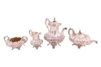 A William IV four-piece silver tea service of compressed melon form, London 1836, maker JH DE not found, the set comprises two handled sugar, teapot, milk jug and hot water, chased with punched matted and sunflowers, raised on skirted bases with scroll fe