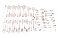A matched part canteen of mostly "Fiddle Pattern" silver flatware, mixed makes and dates, comprising eight table (soup) spoons, eleven table forks, four dessert forks and other oddments of silver flatware, 70.73 ozt/ 2.2 kg combined gross weight of weigha
