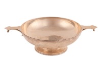 A Silver Arts & Crafts pedestal quaich-style dish, two angled side handles, the stem with circular bosses and double beaded borders throughout. 31cm x 9cm. 474grams, 15.2ozt