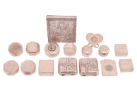 An agglomeration of small, mostly 20th-century and later silver pill/gift boxes, and a small votive panel decorated with the figure of The Holy Mother, a guillotine cigar cutter and other items. 15.25 ozt 474.5 grams