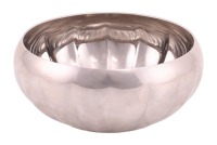 A Georg Jensen 'Legacy' stainless steel segmental circular bowl with slightly inverted rim, bearing branding to the base. 10 cm diameter.