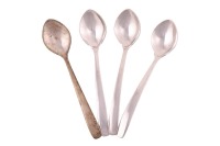 Four Swedish silver dessert spoons designed by Einar Telander; with ovoid bowls and curved handles, hand hammered throughout. full Swedish marks for 1988, maker's mark for Karl Axel Karlsson and facsimile signature for designer Einar Telander. 18cm length