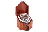 A millennium silver rat tail canteen for six in a fitted mahogany and satinwood box; comprising three table spoons, six larger dessert spoons, six smaller dessert spoons, six table forks, six silver dessert forks, six silver teaspoons, six pairs of silver