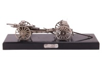 Captain G.B. Clilverd (Graham Barry Clilverd, 1883-1978) Of Military History Interest: An incredibly detailed and intricate silver-plated scale model of a British, Royal Field Artillery, Mk IV 18pdr field gun and limber, the gun with functioning recoil da